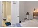 Bedroom leading to a bathroom with bathtub, neutral colors and bright light at 2481 Southhaven Ln, Buford, GA 30519