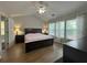Main bedroom featuring a ceiling fan, vaulted ceiling and natural light at 2481 Southhaven Ln, Buford, GA 30519