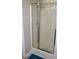 Bathroom shower enclosed by glass door and neutral wall color at 2481 Southhaven Ln, Buford, GA 30519