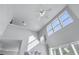 A tall vaulted ceiling with dormer windows adds an airiness and architectural detail to the home at 2481 Southhaven Ln, Buford, GA 30519