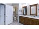 Elegant bathroom with double vanities, decorative mirrors, and a separate toilet room at 5345 Glenhaven Dr, Cumming, GA 30041