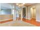 Spacious living room featuring hardwood floors, decorative columns, and seamless flow to adjacent rooms and staircase at 5345 Glenhaven Dr, Cumming, GA 30041