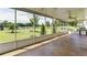 Screened porch, ceiling fans, and a backyard view at 5345 Glenhaven Dr, Cumming, GA 30041