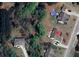 Aerial view of property showing house with roof and pool at 969 Golden Meadows Ln, Loganville, GA 30052