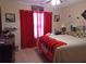 Bright bedroom with decorative wall art, Bulldog blanket, and a ceiling fan at 969 Golden Meadows Ln, Loganville, GA 30052