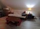 Bonus room with futon and wood flooring at 969 Golden Meadows Ln, Loganville, GA 30052