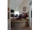 Spacious living room with fireplace, piano, and lots of seating at 969 Golden Meadows Ln, Loganville, GA 30052