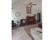 Cozy living room showcasing a piano, ceiling fan, and elegant decor, creating a comfortable atmosphere at 969 Golden Meadows Ln, Loganville, GA 30052