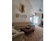 Inviting living room with comfortable seating, area rug, high ceilings, and decorative accents at 969 Golden Meadows Ln, Loganville, GA 30052