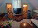 Spacious playroom with built-in display cases, a television, toys, and comfortable seating at 969 Golden Meadows Ln, Loganville, GA 30052