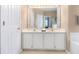 Well-lit bathroom with a dual sink vanity and white cabinets at 1469 Crescent Walk, Decatur, GA 30033
