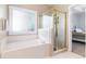 Bathroom with a soaking tub and a separate glass-enclosed shower at 1469 Crescent Walk, Decatur, GA 30033