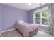Cozy bedroom with a window offering ample natural light at 1469 Crescent Walk, Decatur, GA 30033