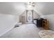 Upstairs bedroom featuring a ceiling fan, a twin size bed, a bookshelf and carpeted floors at 1469 Crescent Walk, Decatur, GA 30033