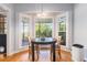 Sun-filled breakfast nook with bay windows overlooking the lush, green exterior at 1469 Crescent Walk, Decatur, GA 30033
