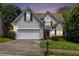 Charming two-story home with a well-maintained lawn, a two-car garage, and mature trees at 1469 Crescent Walk, Decatur, GA 30033