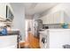Efficient kitchen with stainless steel appliances, white cabinets, and hardwood floors at 1469 Crescent Walk, Decatur, GA 30033