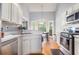 Bright kitchen featuring stainless steel appliances, white cabinets, and a breakfast nook at 1469 Crescent Walk, Decatur, GA 30033
