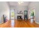 Comfortable living room with hardwood floors, a fireplace and views of the exterior at 1469 Crescent Walk, Decatur, GA 30033