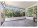 An enclosed sunroom with large windows and dark floors at 1469 Crescent Walk, Decatur, GA 30033