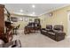 Relaxing living room with leather chairs, a desk, and built-in shelves at 358 Nature Brook Se Walk, Smyrna, GA 30082