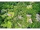 Expansive aerial view of a home nestled amongst lush greenery and mature trees at 5491 Hiram Rd, Powder Springs, GA 30127