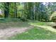 Grassy backyard featuring mature trees, and vegetation at 5491 Hiram Rd, Powder Springs, GA 30127