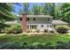 Backyard featuring a brick chimney and landscaped area, providing a serene outdoor space at 5491 Hiram Rd, Powder Springs, GA 30127