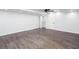 View of finished basement showing wood-style flooring, a ceiling fan, and closet at 5491 Hiram Rd, Powder Springs, GA 30127
