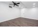Finished basement with window, ceiling fan and door, plus wood-style flooring at 5491 Hiram Rd, Powder Springs, GA 30127