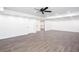 Basement area with wood grain flooring, recessed lighting, and white walls creates a spacious and bright atmosphere at 5491 Hiram Rd, Powder Springs, GA 30127