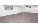 Finished basement with wood-style flooring, recessed lighting, windows, and door to outside at 5491 Hiram Rd, Powder Springs, GA 30127