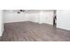 Spacious basement area with light wood grain flooring, recessed lighting, and white walls is ready to be finished at 5491 Hiram Rd, Powder Springs, GA 30127