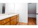 Bathroom with single sink vanity, cabinet storage, and tile floors at 5491 Hiram Rd, Powder Springs, GA 30127