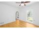 Well-lit bedroom with hardwood floors, ceiling fan, and plenty of natural light at 5491 Hiram Rd, Powder Springs, GA 30127