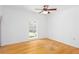 Bright, spacious bedroom with hardwood floors, ceiling fan, and natural light at 5491 Hiram Rd, Powder Springs, GA 30127