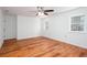 Bedroom with hardwood floors, a ceiling fan, and natural light from the windows at 5491 Hiram Rd, Powder Springs, GA 30127