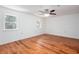 Bedroom with wood-look flooring, neutral walls, and a ceiling fan at 5491 Hiram Rd, Powder Springs, GA 30127