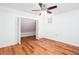 Bright bedroom with hardwood floors, ceiling fan, and closet at 5491 Hiram Rd, Powder Springs, GA 30127