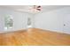 Bright bedroom with hardwood floors, two large windows, ceiling fan and neutral walls at 5491 Hiram Rd, Powder Springs, GA 30127