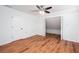 Bright bedroom with hardwood floors, ceiling fan, and closet at 5491 Hiram Rd, Powder Springs, GA 30127