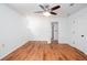 Bright bedroom with hardwood floors, ceiling fan, and closet at 5491 Hiram Rd, Powder Springs, GA 30127