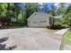 Spacious three-car garage with a driveway and a basketball hoop at 5491 Hiram Rd, Powder Springs, GA 30127