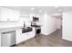Bright kitchen with stainless steel appliances and white cabinetry at 5491 Hiram Rd, Powder Springs, GA 30127