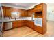 Charming kitchen with wooden cabinets, stainless steel dishwasher, and countertops at 5491 Hiram Rd, Powder Springs, GA 30127
