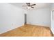 Bright room featuring neutral paint, hardwood floors, crown molding, and a ceiling fan at 5491 Hiram Rd, Powder Springs, GA 30127