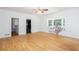 Bright room featuring neutral paint, hardwood floors, a ceiling fan, and a window seat at 5491 Hiram Rd, Powder Springs, GA 30127
