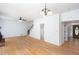 Spacious living room with hardwood floors, ceiling fan, and staircase at 5491 Hiram Rd, Powder Springs, GA 30127