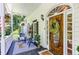 Charming front porch with stylish seating and decor near a decorative wood front door at 5491 Hiram Rd, Powder Springs, GA 30127