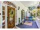 Cozy porch with a swing, wreath on the front door, and classic architectural details at 5491 Hiram Rd, Powder Springs, GA 30127